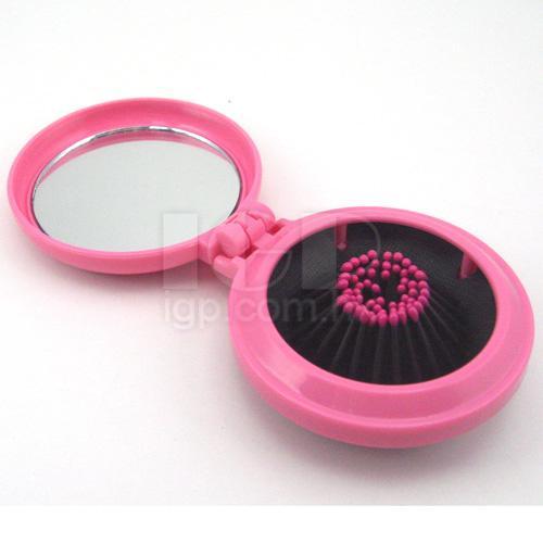 Mirror with comb